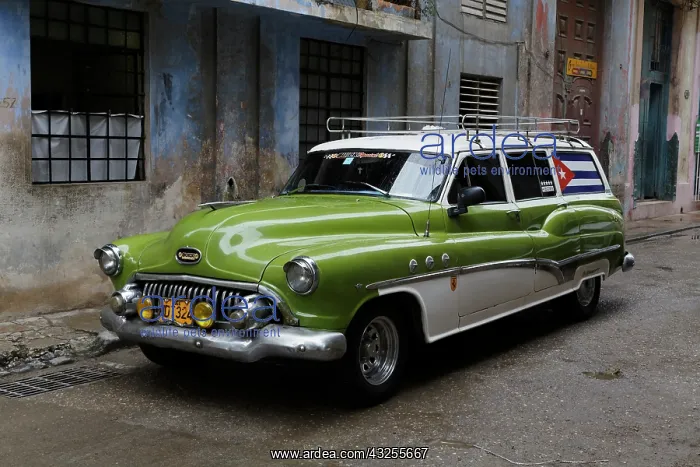 : 1950's era antique car and street scene : 1950's era antique car and street scene