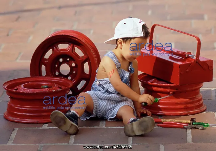 : 80200283 Child - boy mechanic in dungarees working : 80200283 Child - boy mechanic in dungarees working