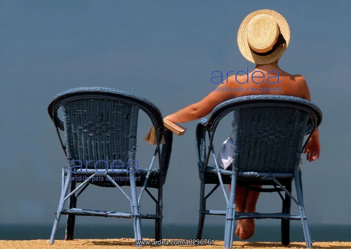 : 80201367 Woman - lady wearing sun-hat sitting on : 80201367 Woman - lady wearing sun-hat sitting on