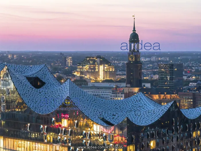 : Aerial view of the Elbphilarmonie with St Michael's Church and Hamburg Bunker in the background at blue hour : Aerial view of the Elbphilarmonie with St Michael's Church and Hamburg Bunker in the background at blue hour