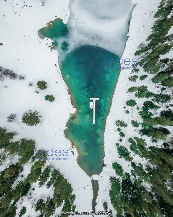 : Aerial view, partly frozen Lake Cauma in winter : Aerial view, partly frozen Lake Cauma in winter