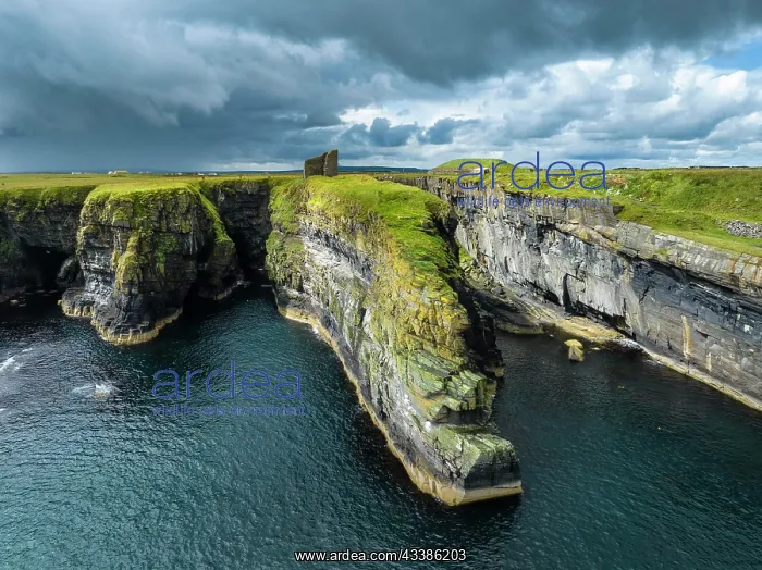 : Aerial view of the ruined Castle of Old Wick surrounded b : Aerial view of the ruined Castle of Old Wick surrounded b