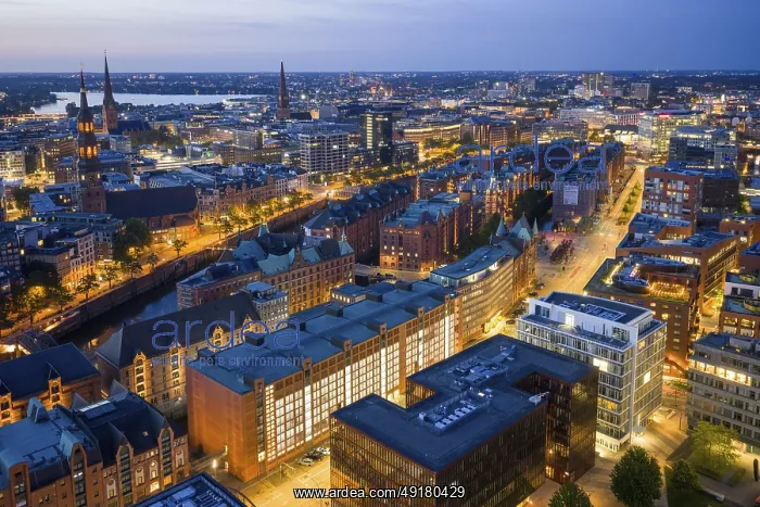  : Aerial view of the Speicherstadt Hamburg at blue hour with churches and Alster in the background