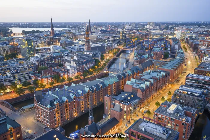 : Aerial view of the Speicherstadt Hamburg at blue hour with churches and Alster in the background : Aerial view of the Speicherstadt Hamburg at blue hour with churches and Alster in the background