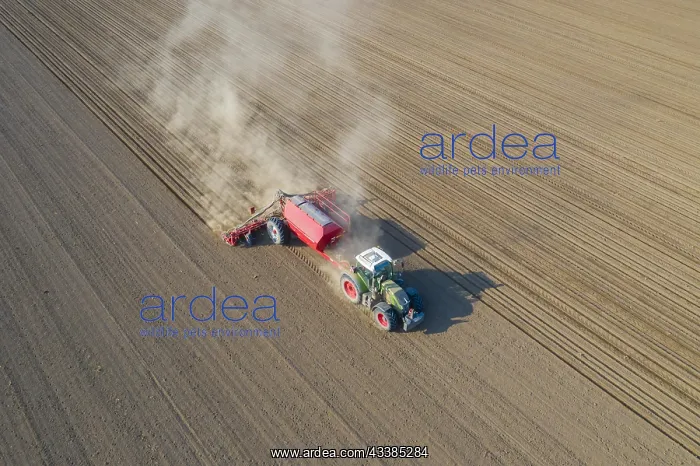 : Aerial view over tractor with pneumatic seed drill : Aerial view over tractor with pneumatic seed drill