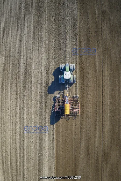 : Aerial view over tractor with pneumatic seed drill : Aerial view over tractor with pneumatic seed drill