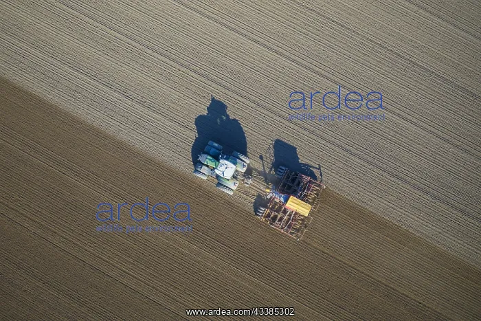 : Aerial view over tractor with pneumatic seed drill : Aerial view over tractor with pneumatic seed drill