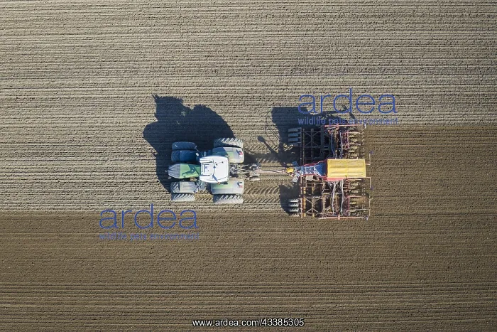 : Aerial view over tractor with pneumatic seed drill : Aerial view over tractor with pneumatic seed drill