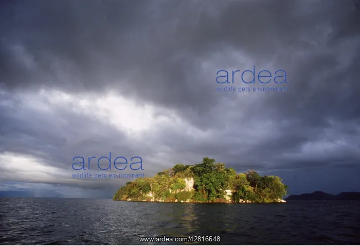 : Africa - Storm clouds over islet : Africa - Storm clouds over islet