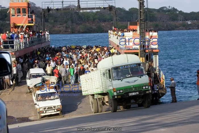 : Africa - Vehicles and passengers disembarking from : Africa - Vehicles and passengers disembarking from