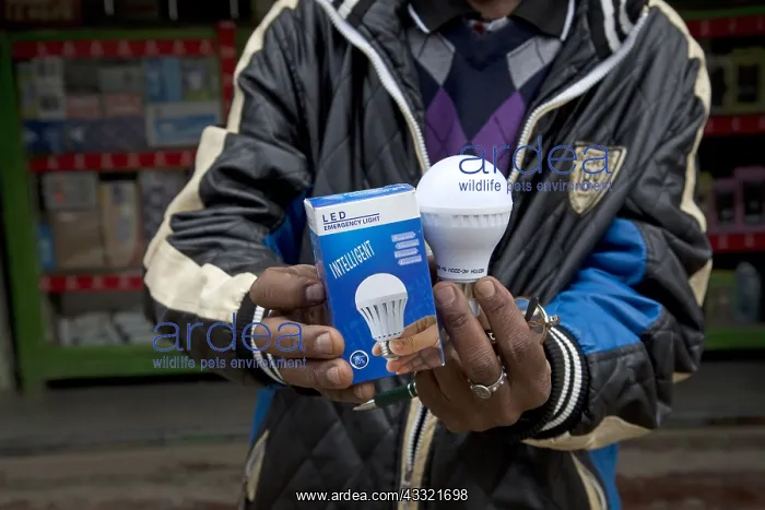 : African man holding intelligent energy effiicient : African man holding intelligent energy effiicient