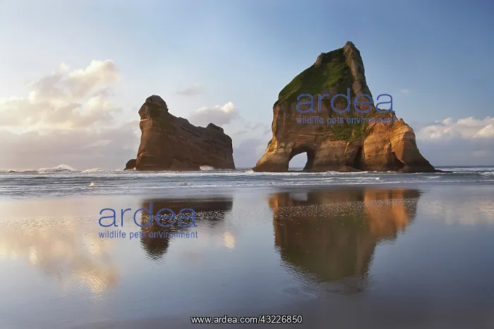 : Archway Islands Reflected in Wet Sands of : Archway Islands Reflected in Wet Sands of