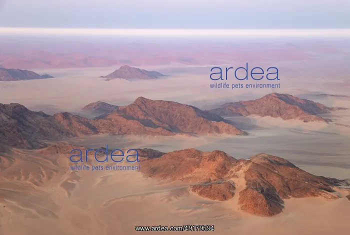 : Arid plains and isolated mountain ridges at the edge of the Namib Desert : Arid plains and isolated mountain ridges at the edge of the Namib Desert