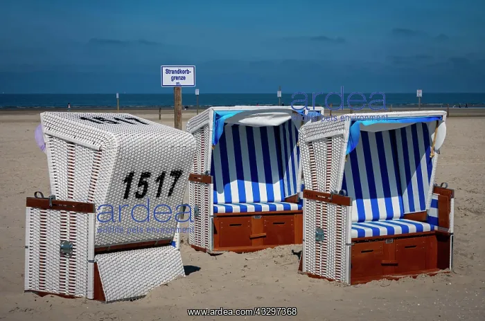  : Beach chairs with sign Strandkorbgrenze, beach