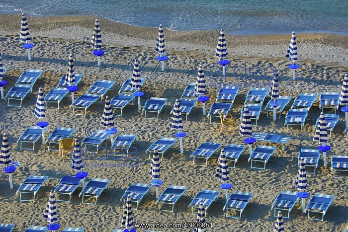 : Beach chairs and umbrellas on the beach at Vietri : Beach chairs and umbrellas on the beach at Vietri