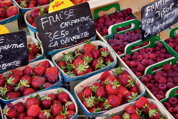 : Berries for sale at the local market in : Berries for sale at the local market in