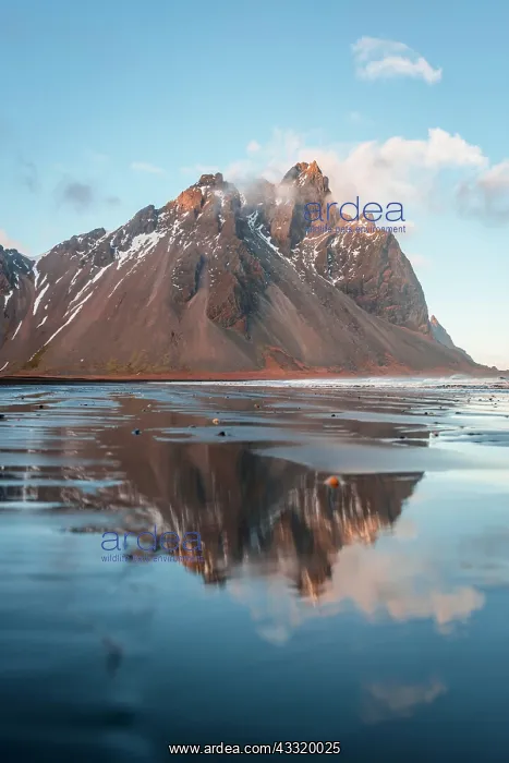 : Black sand beach, lava beach with reflection at : Black sand beach, lava beach with reflection at