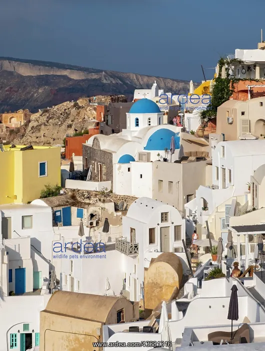 : Blue-domed Church of Agios Nikolaos and caldera : Blue-domed Church of Agios Nikolaos and caldera