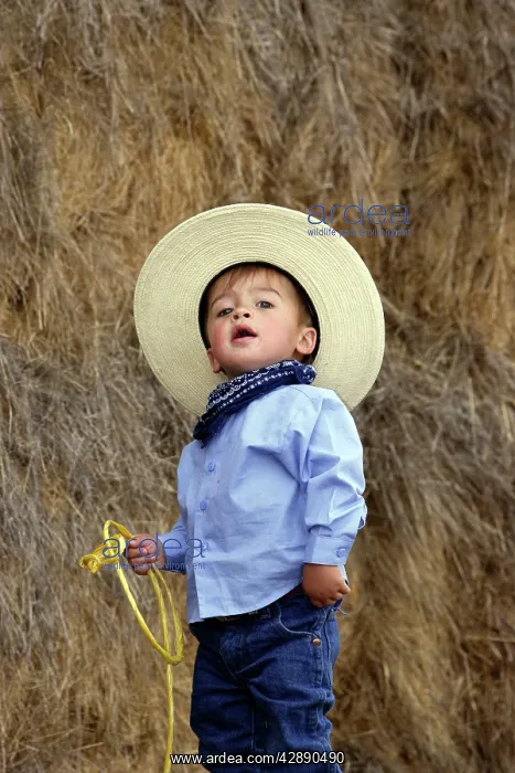 : Boy playing at being a cowboy : Boy playing at being a cowboy