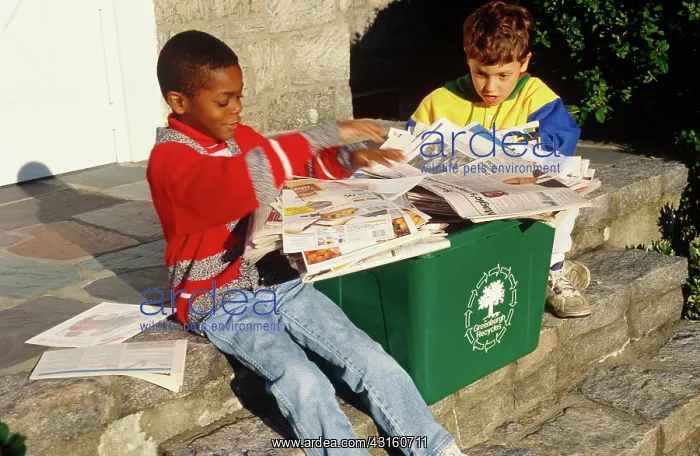 : Two boys recycling : Two boys recycling
