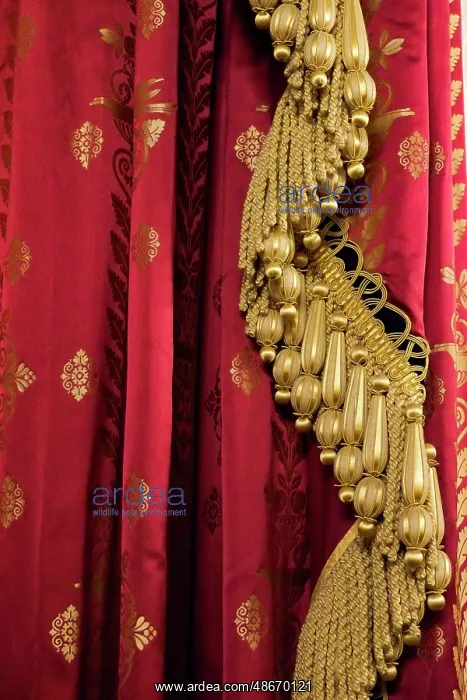 : Brighton, England, United Kingdom. Red and gold fabric and : Brighton, England, United Kingdom. Red and gold fabric and