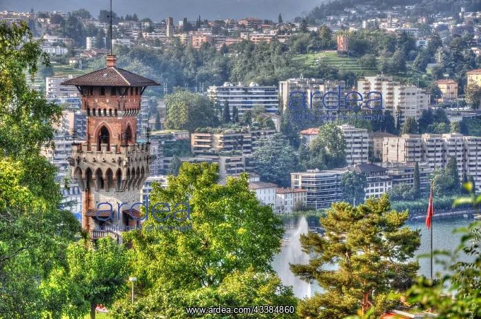  : Castle and houses on the mountain with a lake in