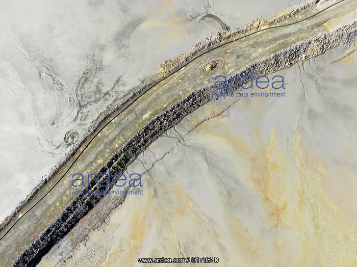 : Causeway at a waste pond in the mineral-rich area of the Rio Tinto mines : Causeway at a waste pond in the mineral-rich area of the Rio Tinto mines