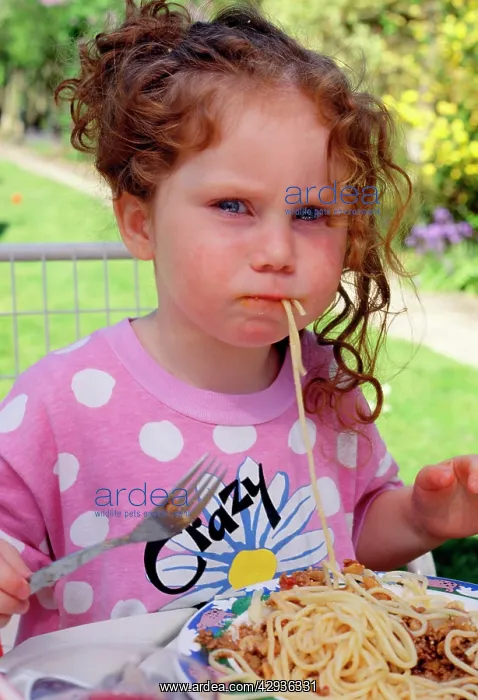  : Child - 3 year old girl eating spaghetti