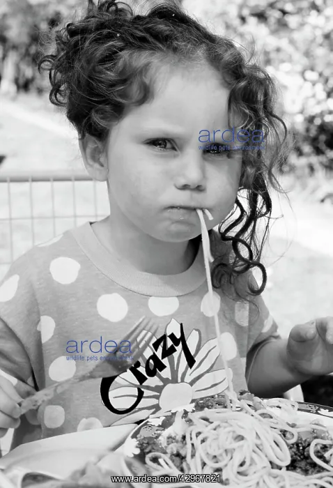 : Child - 3 year old girl eating spaghetti