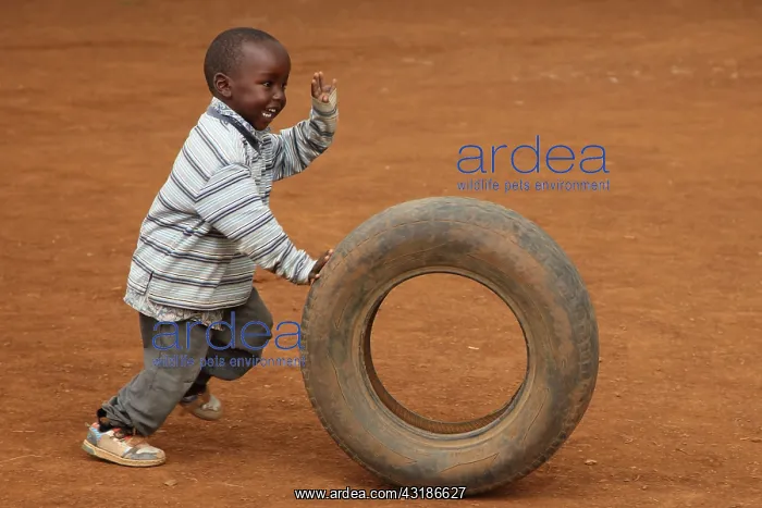 : Child playing with tire, near Eldoret, Kenya, Kalingen : Child playing with tire, near Eldoret, Kenya, Kalingen