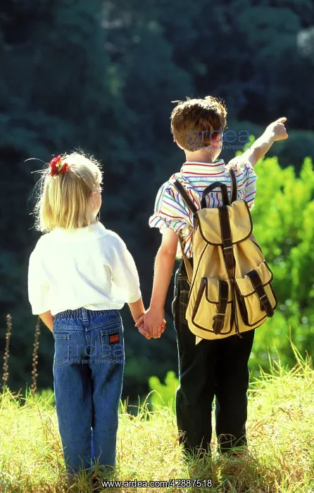 : Children - backview of boy and girl holding hands : Children - backview of boy and girl holding hands