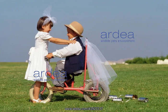 : CHILDREN - cute boy & girl on bike : CHILDREN - cute boy & girl on bike