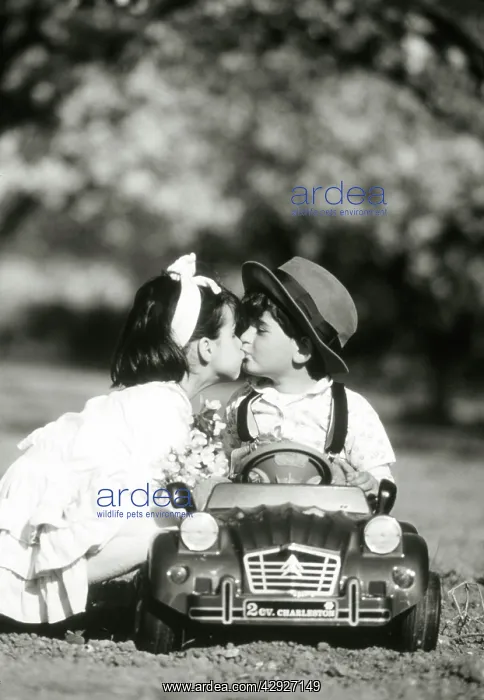 : Children - kiss in toy car : Children - kiss in toy car