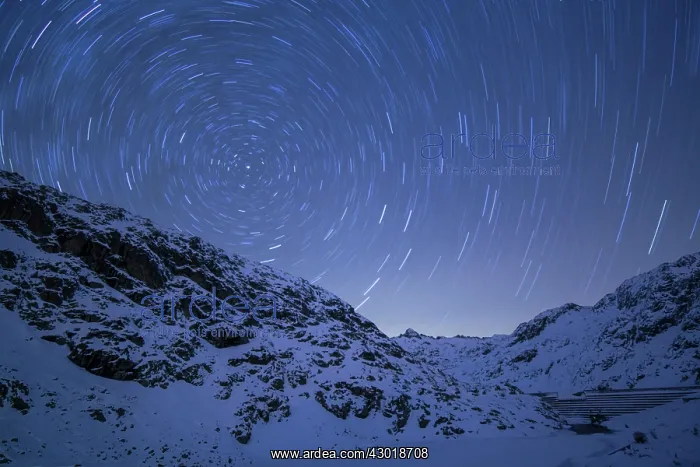 : Circumpolar Star Trails in snowy mountains at night : Circumpolar Star Trails in snowy mountains at night