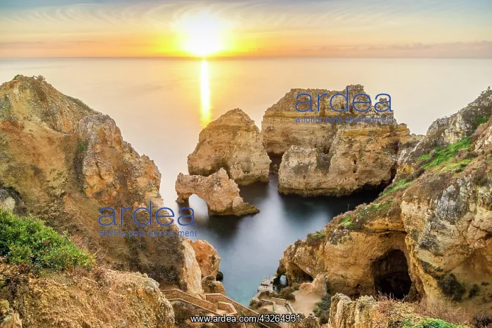 : Cliffs and arches in Ponta da Piedade at sunrise : Cliffs and arches in Ponta da Piedade at sunrise