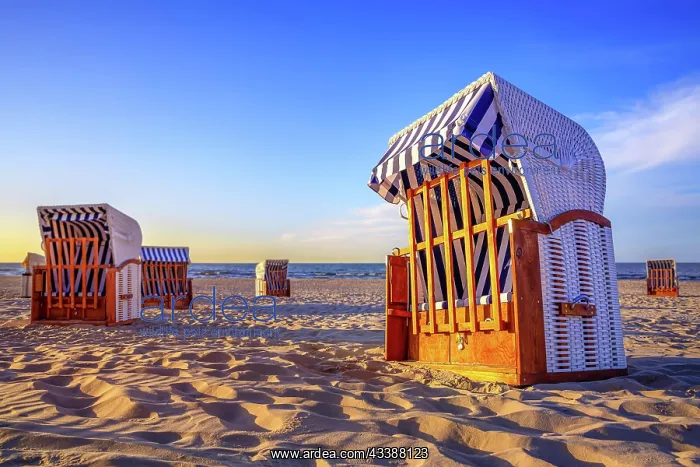 : closed beach chairs against a sunset : closed beach chairs against a sunset