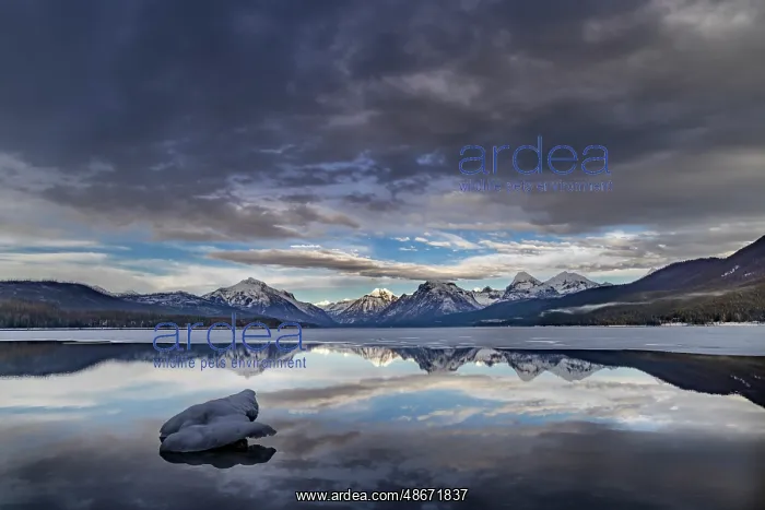 : Clouds reflect in opening in the ice on Lake McDonald in : Clouds reflect in opening in the ice on Lake McDonald in