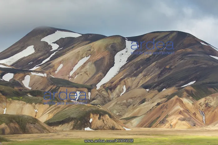 : Colored rhyolite mountains with remains of snow : Colored rhyolite mountains with remains of snow