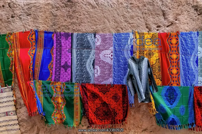 : Colorful clothing are sold in the open market in : Colorful clothing are sold in the open market in