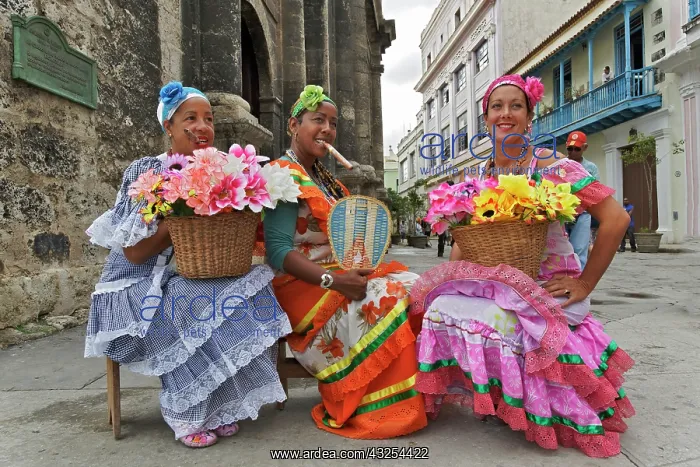 : Colorful Cuban lady with cigar and flowers : Colorful Cuban lady with cigar and flowers