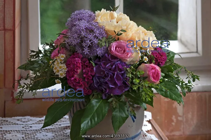 : Colourful spring bouquet in front of window : Colourful spring bouquet in front of window