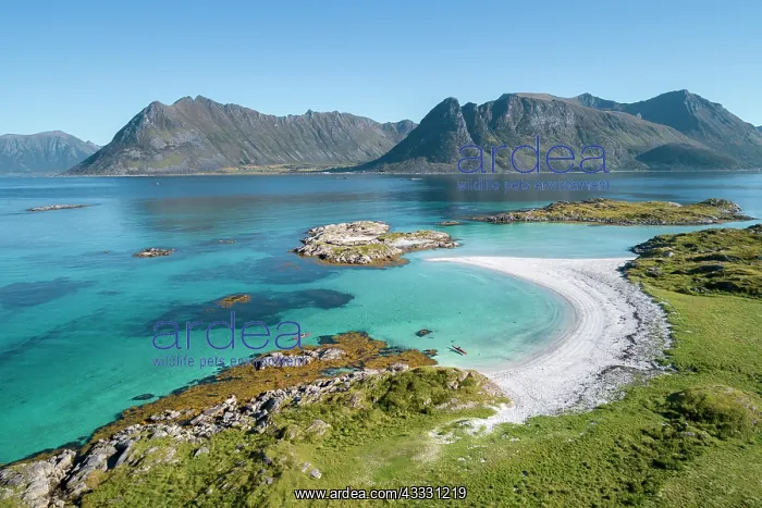  : Crescent-shaped bay, white sandy beach with two