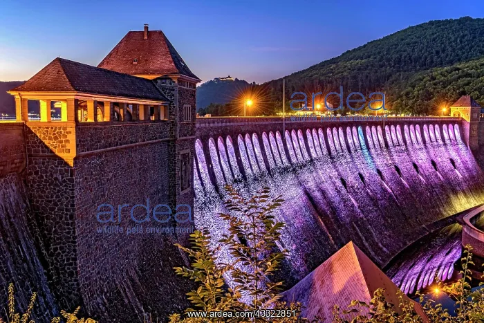 : Dam in the evening light, bright purple illuminated : Dam in the evening light, bright purple illuminated