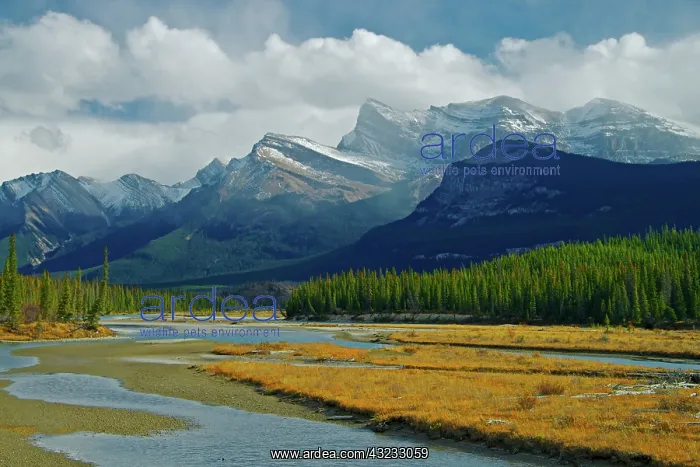: Dramatic clouds pass over the summits of : Dramatic clouds pass over the summits of