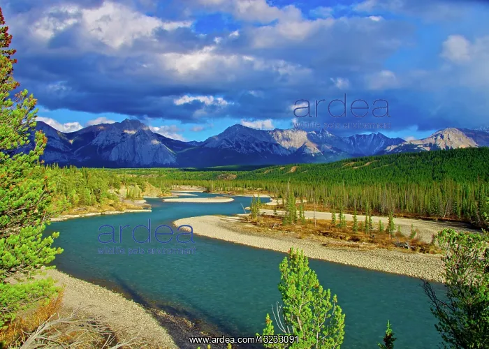: Dramatic clouds pass over the summits of : Dramatic clouds pass over the summits of