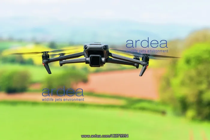 : Drone in flight over fields and farms, Devon, England : Drone in flight over fields and farms, Devon, England