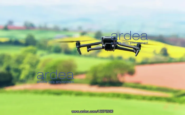 : Drone in flight over fields and farms, Devon, England : Drone in flight over fields and farms, Devon, England