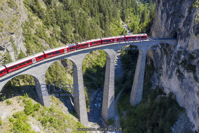: Drone shot of train passing the Landwasserviadukt : Drone shot of train passing the Landwasserviadukt