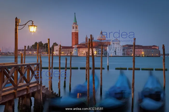 : Early morning view of bobbing gondolas with : Early morning view of bobbing gondolas with