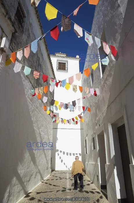 : Elderly man in an alley with brilliantly whitewashed : Elderly man in an alley with brilliantly whitewashed